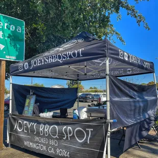 a tent with a sign for joey&apos;s bbq spot