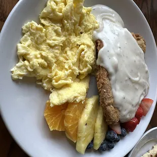 Country Fried Steak with Gravy, Scrambled Eggs and Fruit.