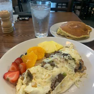 Philly Cheesesteak egg white omelette with a side of fruit and pancakes. 7/6/21