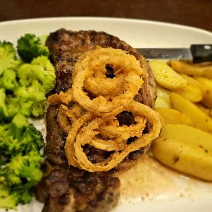 Ribeye, broccoli, onion rings, fingerling potatoes .