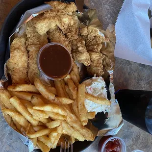 Chicken fingers, fries, slaw.