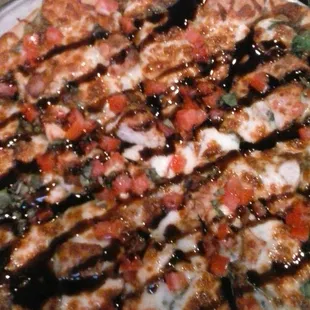 Chicken Bruschetta Grilled chicken breast with fresh garlic, olive oil, tomatoes, spinach, parmigiana and provolone cheese.