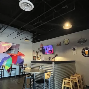 Inside dining at Joey's NY Pizza. Cool Wall Murals!