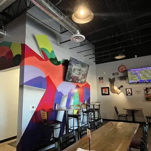 Inside dining a Joey's NY Pizza. Cool Wall Murals!