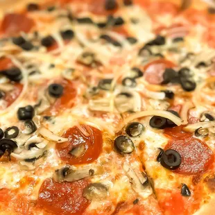 Can you taste the pizza, feel the smell!! Mmmm, fresh toppings; pieces of pepperoni, black olive, onion, mushroom.