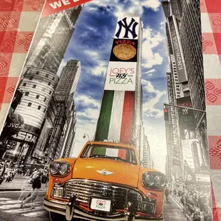 an old car parked in front of a clock tower