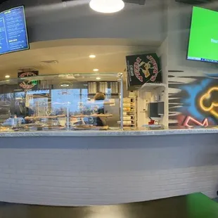 Inside. Great place to grab a pice and a beer.