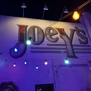 Outside patio Sign painted on the wall of the restaurant!