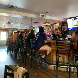 people sitting at the bar