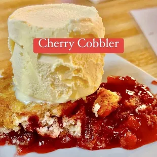 a piece of cake with ice cream on top