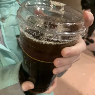 a woman holding a cup of coffee