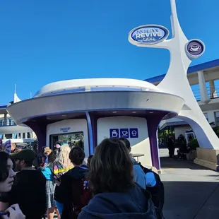a group of people standing in front of a building