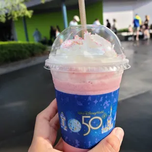 Golden Stardust - $6.39  A creamy wild berry açaí frappe topped with whipped cream and EARidscent blue and gold sprinkles