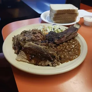 Ribs baked beans coleslaw and pulled pork.
