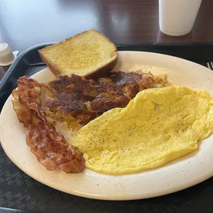 an omelet, bacon and toast