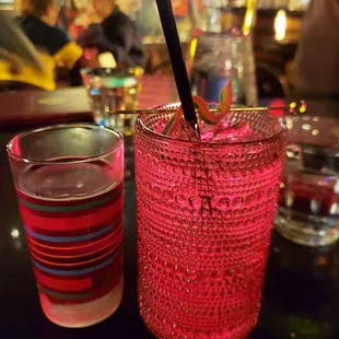 a drink and a shot glass