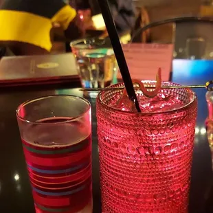 a glass of water and a straw in a restaurant