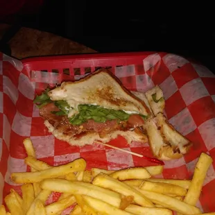 a basket of fries and a sandwich