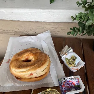 Toasted bagel with butter and jelly.