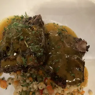 The lamb, on top of couscous, and a delicious sauce