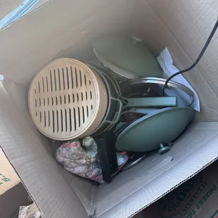 Our place pans thrown in a box