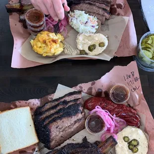 two plates of ribs and sides