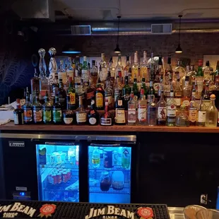 a bar filled with liquor bottles