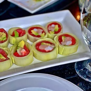 a plate of sushi rolls