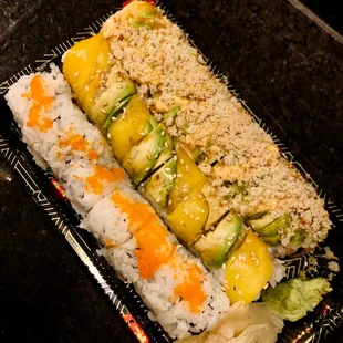 a sushi roll with vegetables and rice