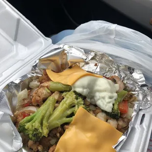 Stuffed potatoes with chicken/shrimp/broccoli/onions/peppers/ mushrooms/and of course cheese!