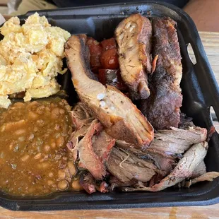 Top left Mac and cheese, hot link, pork ribs, baked beans, brisket