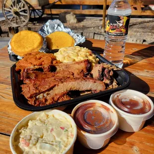 Potato salad, BBQ sauce, pork ribs, brisket, pulled pork, yams, mac and cheese, and corn breads.