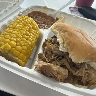 Pulled pork sandwich with corn and beans