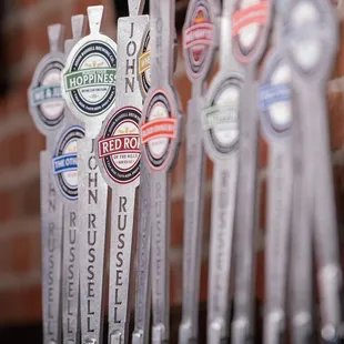 a row of beer taps