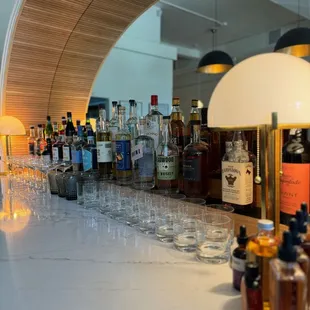 a bar with many bottles of alcohol