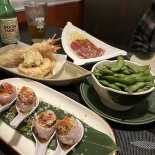 Tuna tataki, edamame, shrimp tempura, and shumai.