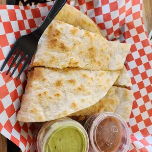 a quesadilla with a fork