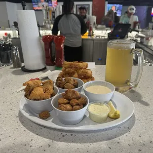 Catfish bites chicken fried chicken and steak bites. Johhhie's light lager and onion rings.