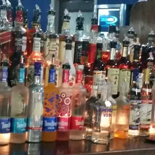 bottles of liquor lined up on the bar