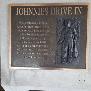 The bronze sign outside, look how cute little Elvis was walking to this place after his grade school nearby.