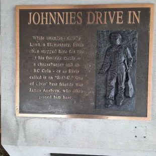 a plaque on the side of a building