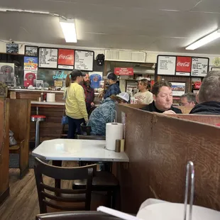 Inside of Johnnie's with one of the owners, Craig, in blue shirt.