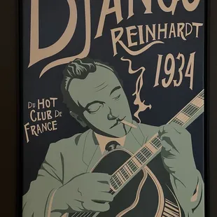 Poster in the bar area on the south side. This guitarist is the inspiration for our band that played there last Saturday.