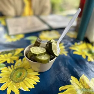 a bowl of pickled cucumbers
