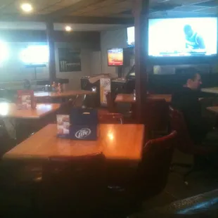 people sitting at tables in a restaurant