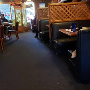 Cozy dining area with pie display case.