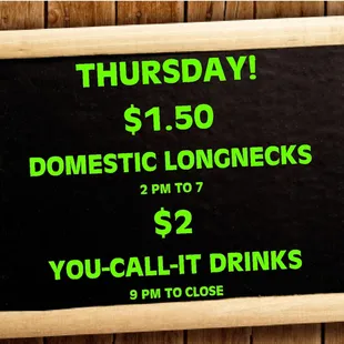 a chalkboard with a price of $ 15