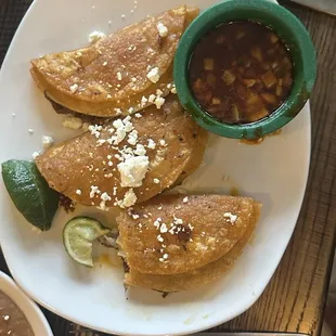 Birria tacos (comes with a healthy portion of beans and rice on a side place)