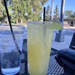 a glass of lemonade and a glass of lemonade