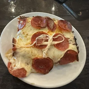 Triple pepperoni pizza